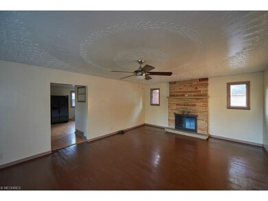 Living room with wood burning fireplace