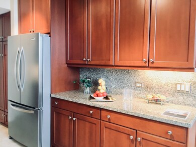 Plentiful cherry cabinets and granite counters hou