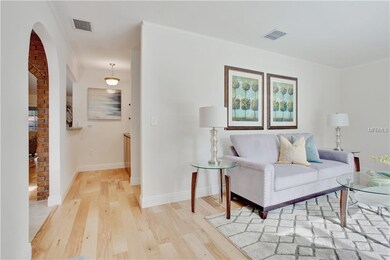 Off of the front room is a wet bar with granite co