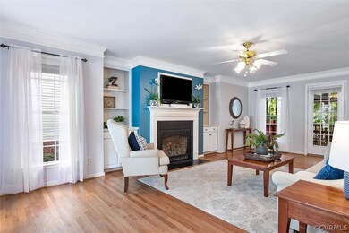 Spacious family room with hardwood flooring