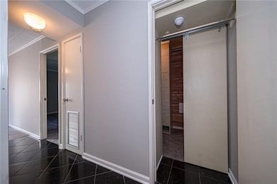 Beautiful tiled entry with a convenient pass throu