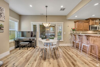 Dining space featuring recessed lighting and light wood-style floors