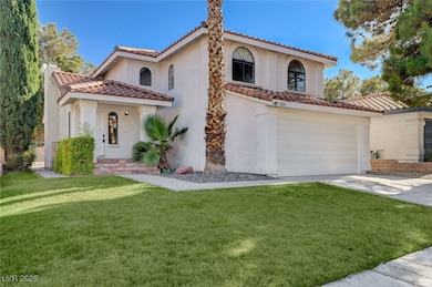 Mediterranean / spanish-style home featuring a til