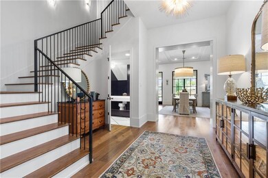 Grand foyer w/ powder room