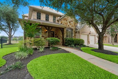 This beauty features a 3 car garage! Front porch i