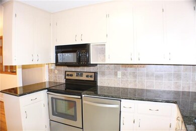 Kitchen with granite countertops, stainless applia