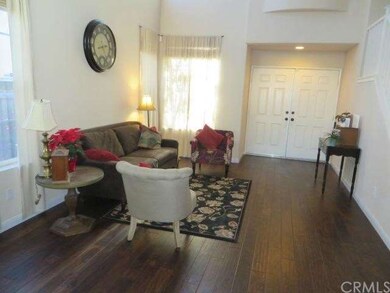 Living room looking to the double-door entry