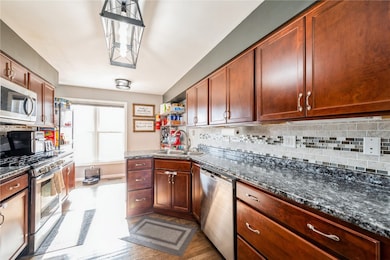 Kitchen features dining nook or use as a pantry ar