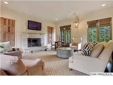 Wonderful den with tall ceilings and fireplace and