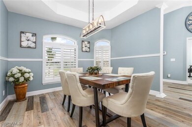 Dining space with wood finished floors, baseboards