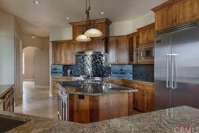 The gourmet kitchen boasts granite counter tops, h