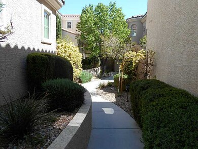 Facade/Exterior Front. Path to entrance in  courty