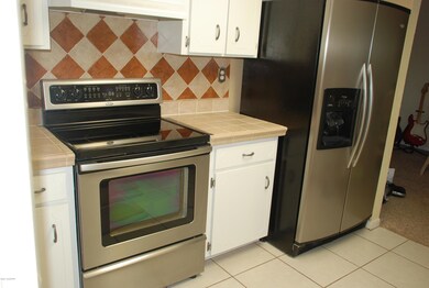 kitchen view with custom backsplash