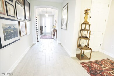 Hallway with light hardwood / wood-style floors