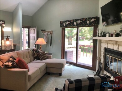 Living room with slider to deck.