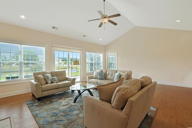 Living room with hardwood / wood-style floors, hig