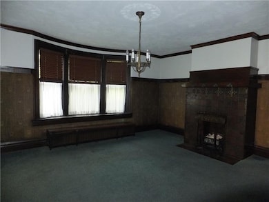 Large dramatic dining room with working fireplace