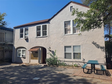 Townhome / multi-family property with stucco sidi
