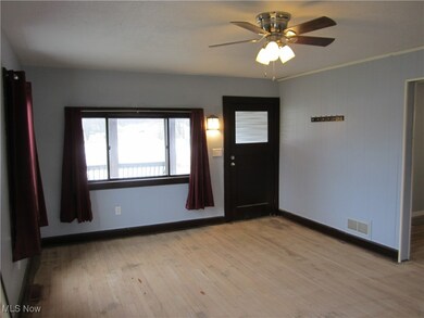 Entryway featuring ceiling fan and light hardwood / wood-style floors