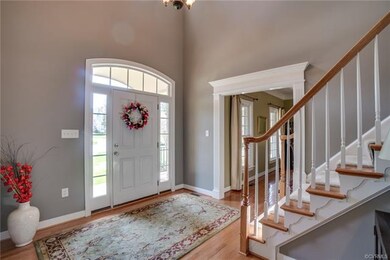 2-Story Foyer with decorative front door with tran