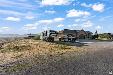 Exterior space featuring a mountain view and driveway