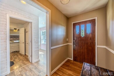 Entrance foyer featuring wood-type flooring, recessed lighting, and ceiling fan