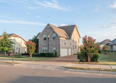 Beautiful all brick home with stone accents. 3 car side entry garage