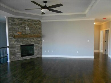 Great room w/ hardwood floors.  Gas fireplace loca