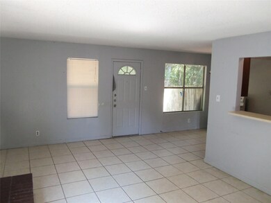 Entrance foyer featuring light tile patterned flo