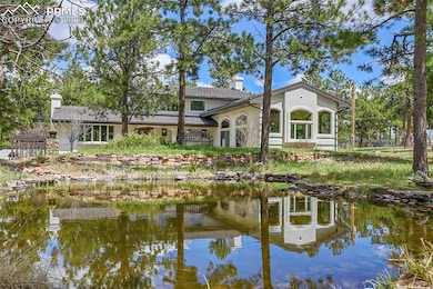 Front of house with view of pond