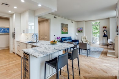 Breakfast bar opens into living area.