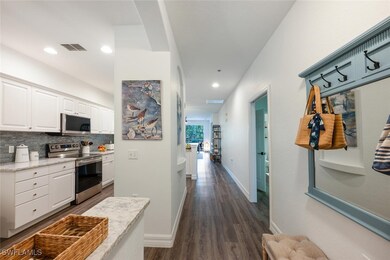 Hall with recessed lighting, visible vents, basebo