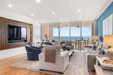 The Great Room opens onto the Covered Terrace with full Sarasota Bay views