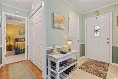 Entrance foyer featuring light wood-type flooring,
