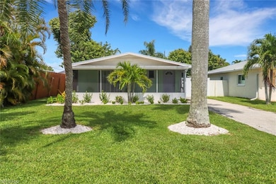 Single story home featuring a sunroom and a front 