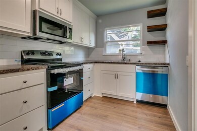Kitchen featuring appliances with stainless steel 