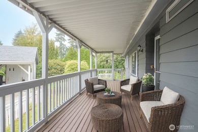 Enjoy a front porch that offers access to the fenced yard at each end. Plenty of room for entertaining - Virtually staged to inspire your vision of the space.