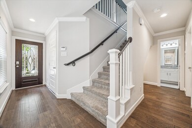 The first floor offers a mudroom storage area, two