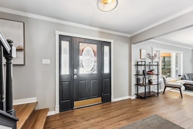 Etched front door and spacious entry