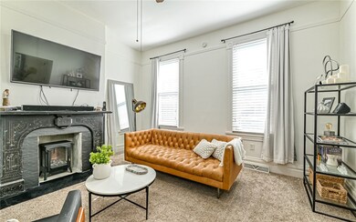 The living room with decorative marble fireplace