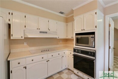 Another view of the kitchen with more cabinets.  D