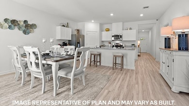 Dining space with light wood-type flooring