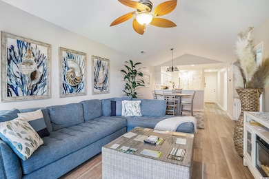 Living area with light wood finished floors, lofte