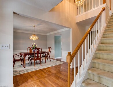Two story Foyer boasts hardwood floors, access to 