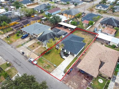 Aerial view of residential area with property boundaries highlighted
