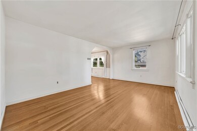 Empty room with a baseboard heating unit and light