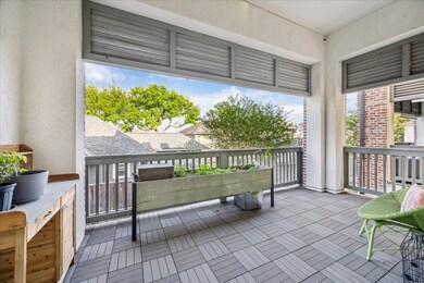 Spacious covered balcony with modern tiling and pa