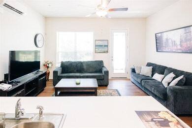 Living area featuring a wall mounted air conditio