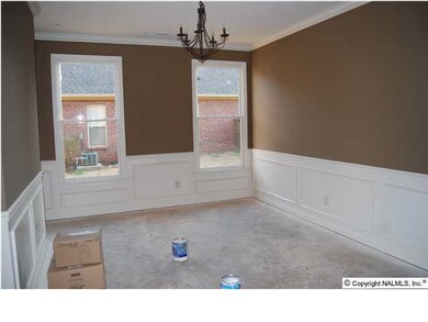 Dining room with chair rail and shadow boxes.