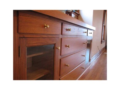 Other. Built-in oak buffet with glass doors and dr